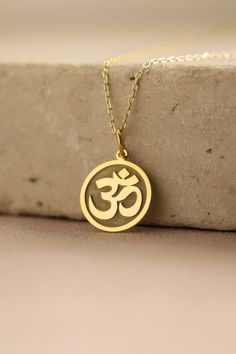 Gold Om Pendant - Yoga Gold Necklace ● Material of pendant: Solid Gold 14k ( REAL GOLD ) ● Metal Stamp: 14k ( REAL GOLD ) ● The pendant is available in 5 sizes: - 12,7 mm / 0.5 inches (Diameter) - 14,0 mm / 0,55 inches ( Diameter ) In the photos - 15,3 mm / 0.6 inches ( Diameter ) - 16,5 mm / 0,65 inches ( Diameter ) - 19,1 mm / 0,75 inches ( Diameter ) ( In the photos the size is 14mm / 0.55 inches Diameter ) ( Jump Ring inner diameter: 4 mm ) ● Material of chain: Solid gold 14k ( REAL GOLD ) I Om Locket Gold For Men, Om Pendant Gold For Women, Om Locket Gold, Om Locket, Yoga Pendant