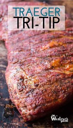 a close up of a steak on a grill with the words traeger tri - tip above it