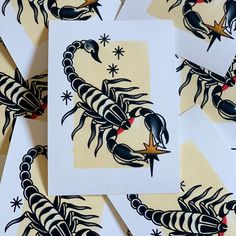 several cards with black and white designs on them, each featuring an image of a scorpion