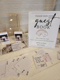 the guest book is on display with cards and envelopes for guests to sign in