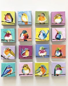 several colorful birds are painted on small square tiles, each with different colors and sizes