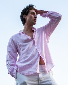 A staple for any vacation wardrobe this airy pale pink linen shirt looks great whether you're in your swim trunks, linen pants or jeans. All our solid color linen shirts have an extra surprise of our distinctive crossed palm M logo printed pink and white linen under the collar and inside the cuffs. Only to be seen if you want to show it! Pink Linen Shirt, M Logo, Linen Shirts, Pink House, Linen Shirt Men, Mens Linen, Pink Houses, Holiday Wardrobe, Pink Linen