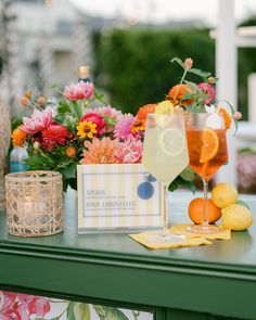 a table with flowers and drinks on it