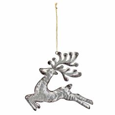 a metal reindeer ornament hanging from a string