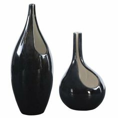 two black vases sitting next to each other on a white background, one is empty