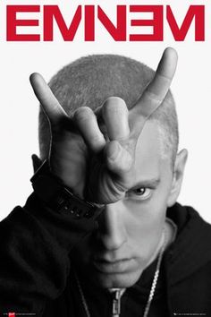 a man making the v sign with his hand and wearing a black hoodie, in front of a white background