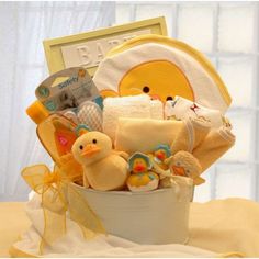 In the Bath Time Baby gift basket, the Plush Momma duck is followed by the baby ducks. Cozy bath accessories include a hooded bath towel, a baby picture frame, and an ultra soft Duckling blanket. Send the Bath Time Baby gift, available in 2 sizes, to your favorite bath time baby! (Available in Blue, Yellow and Pink) Includes: Baby Wash Tub 8" round, 7 oz. Johnson & Johnson Tearless Baby Shampoo, 2 100% Cotton Tee-shirts Hooded Baby Bath Towel (various designs, not all are ducks), 2 Baby Caps, 4 Baby Bathtime, Baby Bath Gift, Bath Gift Basket, Baby Picture Frame, Bathtime Fun, Cozy Bath, Baby Hooded Bath Towel, Baby Picture Frames, Baby Bath Towel