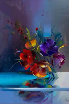 a vase filled with colorful flowers on top of a table