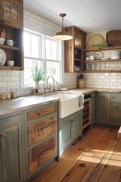 a kitchen with wooden floors and green cabinets