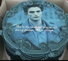 there is a cake in the box that has a picture of edward pattie on it