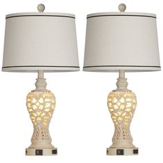 two white table lamps with shades on them