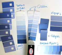 some blue and white paint samples on a table