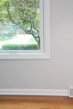 an air conditioner sitting on the floor in front of a window