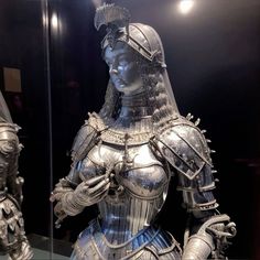 a statue of a woman dressed in armor