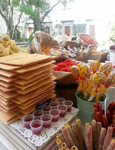 a table filled with lots of food and snacks