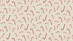 a pattern with candy canes on a beige background