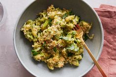 a bowl filled with broccoli and topped with parmesan cheese