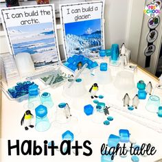 the table is set up with penguins and icebergs for an arctic themed party