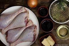 raw chicken and other ingredients on a wooden table