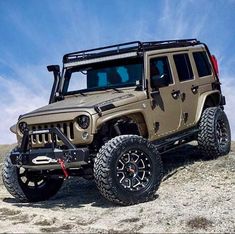 a jeep is parked on the side of a hill