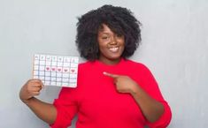 Black woman in a red dress holding up a calendar. Normal Blood Glucose Levels, Almond Butter Smoothie, Prenatal Health, Trying To Get Pregnant, Diet Culture, Pelvic Pain, Menstrual Cramps, Social Engagement, American Woman