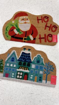 two doormats with santa clause on them