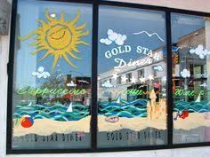 a window with the words gold star diner painted on it