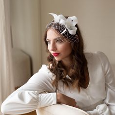 The elegant wedding fascinator adorned with veiling sits on comfortable double headband. The headband is made of millinery wire, firm, but bendable so you can adjust it to your headsize or hairstyle. The headband is wrapped in silk, either in beige or black colour. It can be easily placed to any hairstyle, to loose or short hair. Please, note, the veiling is not shaped as a birdcage.  The headpiece is hand made of premium sinamay using traditional millinery technique.  Colour: ivory If you would Simple Fascinator, Vintage Tea Length Dress, Bow Fascinator, Double Headband, The Birdcage, Mini Hats, Elegant Bridal Gown, Short Veil, Blusher Veil