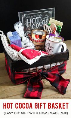 hot cocoa gift basket with homemade mix on wooden table next to glass sign that reads, hot cocoa gift basket easy diy gift with homemade mix