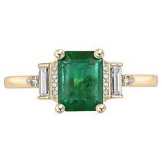 Experience sheer luxury with our Emerald and Diamond Ring, where a captivating emerald cut Zambian emerald takes center stage, exuding a lush rich green hue and transparent clarity. Expertly set in a vertical four-prong arrangement, this emerald is elegantly complemented by four petite round cut diamonds along its sides, a bezel-set baguette cut diamond next to it, and a delicate round cut diamond at the end. Crafted in 14k yellow gold, this masterpiece seamlessly merges classic design with mode Emerald And Diamond Ring, Emerald Gem, Diamond Accent Ring, Tiny Bow, Zambian Emerald, Minimalist Gifts, Yellow Gold Setting, Baguette Cut Diamond, Rich Green