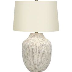 a white table lamp with a beige shade