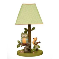 a lamp with an owl and other animals on it