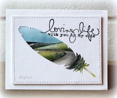 a card with an image of a feather and the words loving life with your eyes