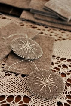 several pieces of cloth are sitting on a doily