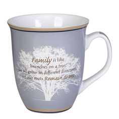 a coffee cup with an image of a tree and the words family is like branches on a tree