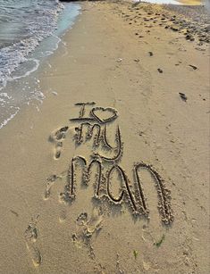 the words on the sand are written in the sand at the beach, and there is no image here to provide a caption for