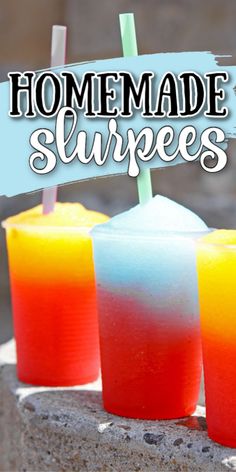 three colorful drinks sitting on top of a stone slab with the words homemade slurpees written above them