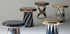 several different stools and tables are shown in various colors, shapes and sizes on a white surface