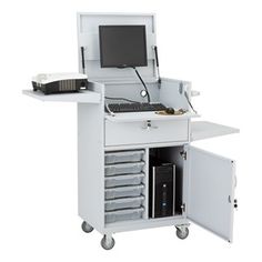 a white computer desk with drawers and a monitor on it's side, in front of a white background