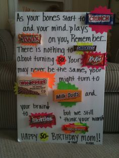 a birthday sign with candy bars on it