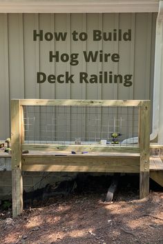 a wooden bench sitting next to a building with the words diy wire deck railing on it