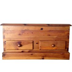 a wooden chest with three drawers on one side and two knobs on the other