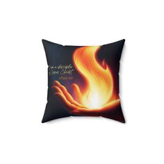 a pillow with the bible verse on it and flames coming out from its palm,