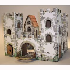 a paper model of a castle with lots of windows