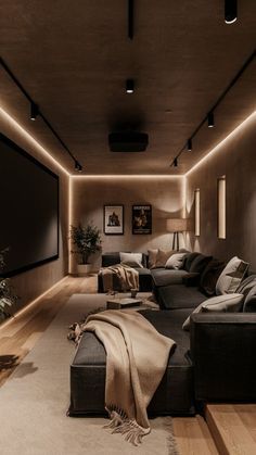 a living room filled with furniture and a flat screen tv mounted to the side of a wall