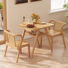 a wooden table with two chairs and a bowl of fruit on the dining room table