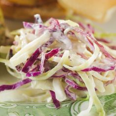 there is a salad on the plate with lettuce and other things around it