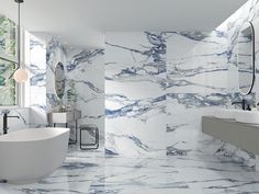 a bathroom with marble walls and floors