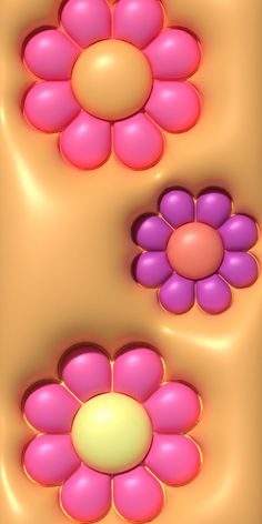 three pink and purple flowers floating on top of each other