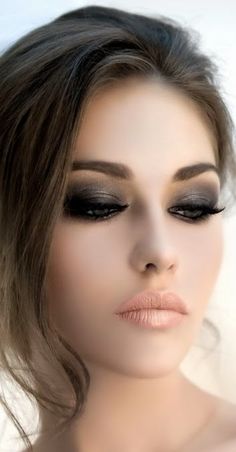 a woman's face with black and white makeup